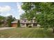 Charming two-story home featuring a well-manicured lawn, stone accents, and a two-car garage at 3818 S Creekside Dr, New Palestine, IN 46163