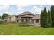 A spacious backyard with a beautiful gazebo attached to the home for outdoor entertaining at 3818 S Creekside Dr, New Palestine, IN 46163