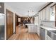 Kitchen featuring granite counters, white cabinets, stainless steel appliances, and hardwood floors at 3818 S Creekside Dr, New Palestine, IN 46163