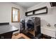 Well-equipped laundry room with new washer and dryer, plus storage at 3818 S Creekside Dr, New Palestine, IN 46163