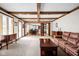 Expansive living room featuring wood beams, fireplace, and open layout at 3818 S Creekside Dr, New Palestine, IN 46163
