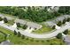 Aerial view of a well-kept suburban neighborhood with mature trees, manicured lawns, and winding streets at 3920 Oak Harbor Ln, Indianapolis, IN 46237