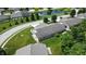 Scenic aerial view of a serene pond surrounded by beautiful homes at 3920 Oak Harbor Ln, Indianapolis, IN 46237