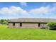 Brick home with lawn, privacy fence, and blue skies at 3920 Oak Harbor Ln, Indianapolis, IN 46237
