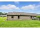 Brick home with lawn, privacy fence, and blue skies at 3920 Oak Harbor Ln, Indianapolis, IN 46237