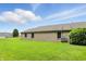 Brick home with lawn, privacy fence, and blue skies at 3920 Oak Harbor Ln, Indianapolis, IN 46237