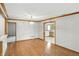 Elegant dining room with hardwood floors and an open view to the kitchen at 3920 Oak Harbor Ln, Indianapolis, IN 46237