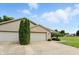 Attractive home with a two-car garage, manicured shrubs, and a spacious driveway at 3920 Oak Harbor Ln, Indianapolis, IN 46237