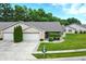 Charming brick home with well-manicured lawn, mature trees, and a two-car garage at 3920 Oak Harbor Ln, Indianapolis, IN 46237