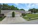 Charming home featuring a two-car garage and a manicured front yard at 3920 Oak Harbor Ln, Indianapolis, IN 46237