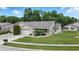 Charming home featuring a two-car garage and a manicured front yard at 3920 Oak Harbor Ln, Indianapolis, IN 46237