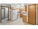 Bright kitchen featuring wooden cabinets, tile backsplash, white appliances and a ceiling fan at 3920 Oak Harbor Ln, Indianapolis, IN 46237