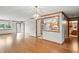 Bright living room with hardwood floors, showcasing a kitchen and bathroom at 3920 Oak Harbor Ln, Indianapolis, IN 46237