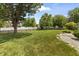 A spacious, well-maintained backyard with a lush lawn and a classic picket fence for privacy at 421 E Delaware St, Fortville, IN 46040