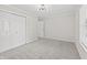 Comfortable bedroom featuring neutral carpet and a large closet and access to hallway at 421 E Delaware St, Fortville, IN 46040
