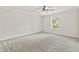 Large empty bedroom featuring neutral walls and soft carpeting ready for the new owner's personal touch at 421 E Delaware St, Fortville, IN 46040