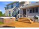 Lovely backyard featuring a wooden deck, hot tub, stairs to backyard, and outdoor grill at 4224 River Rd, Columbus, IN 47203