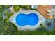 Aerial view of backyard featuring a pool, hot tub and lounge area at 4224 River Rd, Columbus, IN 47203