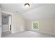 Bright bedroom with neutral walls and carpet and a window at 4224 River Rd, Columbus, IN 47203