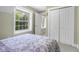 Bright bedroom with large windows and a double door closet with lots of natural light at 4224 River Rd, Columbus, IN 47203