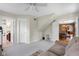 Bonus room with sofa, small chair, doors to bathroom and kitchen area at 4224 River Rd, Columbus, IN 47203