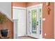 Bright entryway with a white door, closet, stairs and warm wall color at 4224 River Rd, Columbus, IN 47203