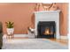 Close-up view of a fireplace with white mantle, decorative plants, and a cozy ambiance at 4224 River Rd, Columbus, IN 47203