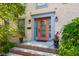 Elegant front door with decorative glass, stylish sidelights, and manicured landscaping at 4224 River Rd, Columbus, IN 47203