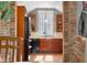 Charming kitchen featuring wood cabinets, a garden window, and stainless appliances at 4224 River Rd, Columbus, IN 47203