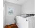 Second floor laundry room with newer washer and dryer and window at 4224 River Rd, Columbus, IN 47203