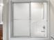 Modern white shower with sliding doors and chrome showerhead at 4224 River Rd, Columbus, IN 47203