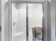 Bright white shower with a glass sliding door and chrome hardware at 4224 River Rd, Columbus, IN 47203