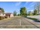 Backyard featuring a large tennis court and fenced-in backyard is perfect for outdoor recreation and entertainment at 4224 River Rd, Columbus, IN 47203