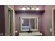 Bright bathroom featuring a stylish vanity, a large mirror, and updated lighting fixtures at 4501 N Wheeling Ave # 5E4, Muncie, IN 47304