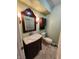 A full bathroom featuring a vintage vanity, medicine cabinet and decorative lighting at 4501 N Wheeling Ave # 5E4, Muncie, IN 47304
