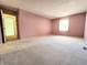 Spacious bedroom with wall-to-wall carpet, neutral walls and a bright window at 4501 N Wheeling Ave # 5E4, Muncie, IN 47304