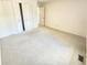 Spacious carpeted bedroom with ample natural light and a large closet at 4501 N Wheeling Ave # 5E4, Muncie, IN 47304
