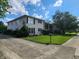 Charming two-story apartment building with white brick and lush green lawn at 4501 N Wheeling Ave # 5E4, Muncie, IN 47304