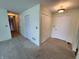 Open hallway with carpet flooring and multiple closets, enhanced by recessed lighting at 4501 N Wheeling Ave # 5E4, Muncie, IN 47304