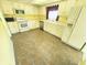 Traditional kitchen featuring white cabinets, modern appliances, and neutral countertops at 4501 N Wheeling Ave # 5E4, Muncie, IN 47304