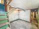 View of basement, including concrete walls, stairs and open ceiling at 4708 Fletcher Ave, Indianapolis, IN 46203