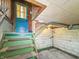 Basement featuring concrete walls, utility fixtures, and painted stairs and door at 4708 Fletcher Ave, Indianapolis, IN 46203