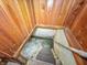 Stairwell leading to basement features wood paneling, and a weathered railing at 4708 Fletcher Ave, Indianapolis, IN 46203