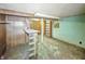 Finished basement with wood paneled and painted walls, glass block and concrete flooring at 4708 Fletcher Ave, Indianapolis, IN 46203