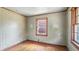 View of the bedroom with a window and decorative wallpapered wall at 4708 Fletcher Ave, Indianapolis, IN 46203