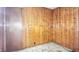 A bedroom showcasing paneled walls and worn floors, highlighting the room's potential at 4708 Fletcher Ave, Indianapolis, IN 46203