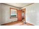 Bedroom featuring wood floor, closet door, and window at 4708 Fletcher Ave, Indianapolis, IN 46203