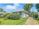 Cozy home featuring a side garage, well-maintained lawn, and classic siding at 4708 Fletcher Ave, Indianapolis, IN 46203