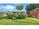 Charming home with manicured bushes, a well-kept lawn, and a classic residential aesthetic at 4708 Fletcher Ave, Indianapolis, IN 46203