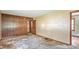 View of the living room with a door and wood paneled wall at 4708 Fletcher Ave, Indianapolis, IN 46203